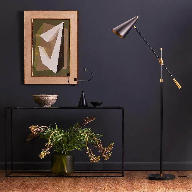 Wood Floor Lamp with Natural Grain for a Warm and Organic FeelMo floor lamp in brass with a black hood